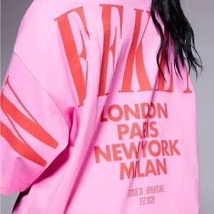 Vibrant Pink Graphic Tee with Bold Red Text